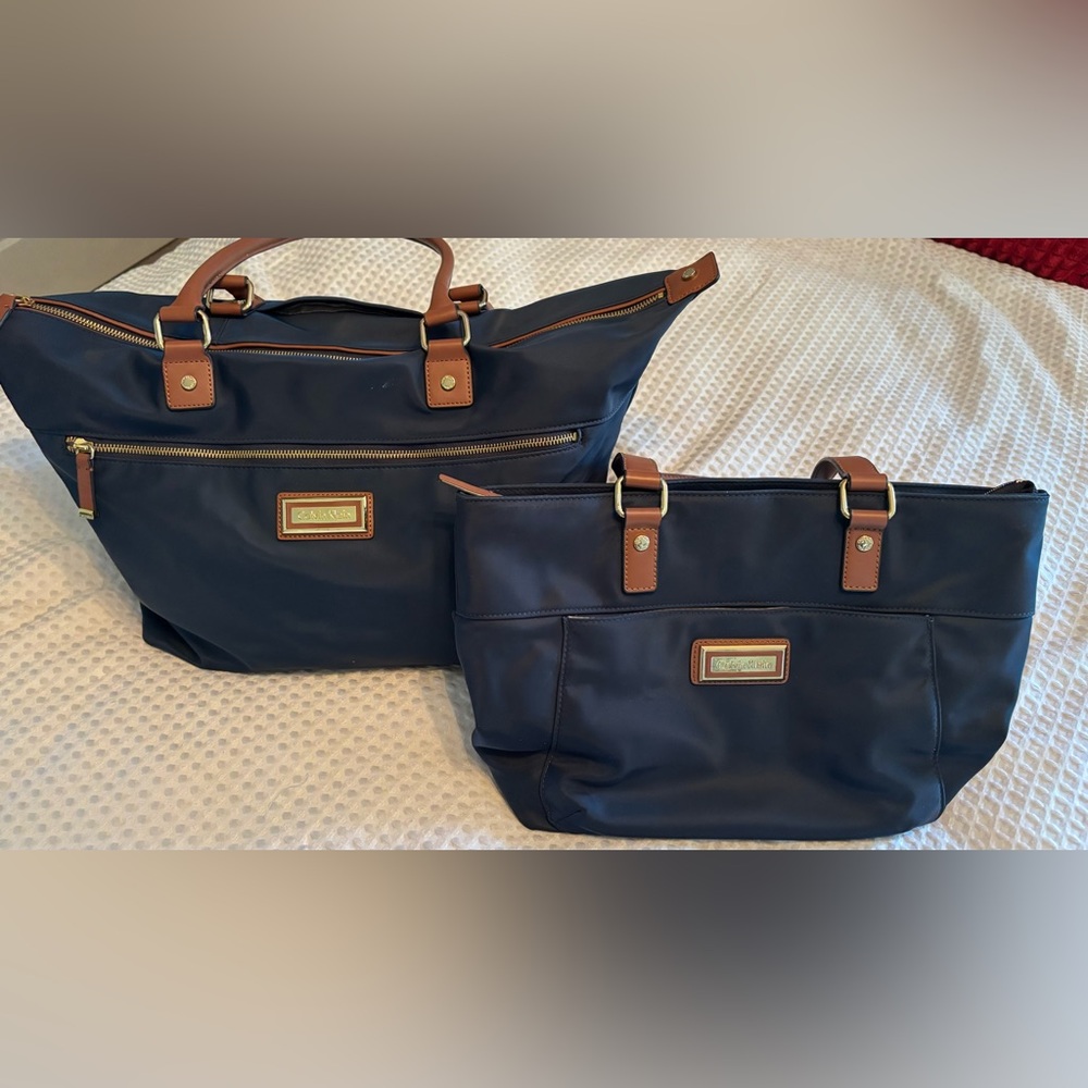 Set of two Calvin Klein Navy Blue travel bags. Purse & weekender bag.